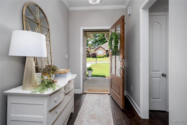 entryway with baseboards, ornamental molding, and dark wood-style flooring