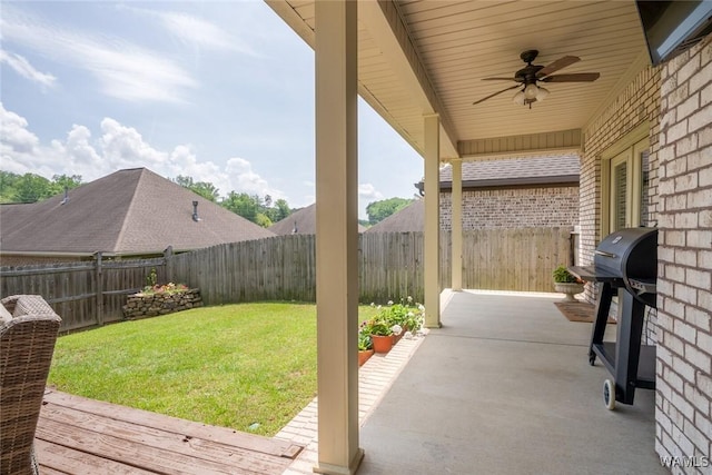 view of patio / terrace with a ceiling fan, a fenced backyard, and a grill