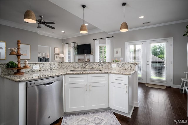 kitchen with stainless steel dishwasher, a sink, and ornamental molding