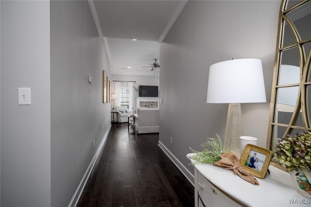 hall with crown molding, recessed lighting, dark wood finished floors, and baseboards
