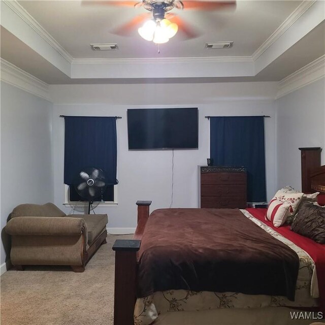 13712 Tab Dr, Northport, AL 35475 - carpeted bedroom featuring a raised ceiling, crown molding, baseboards, and a ceiling fan