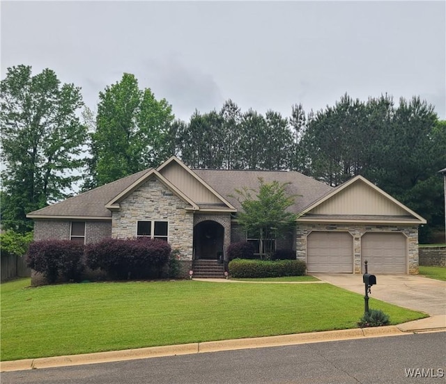 13712 Tab Dr, Northport, AL 35475 - craftsman inspired home with a garage, stone siding, a front yard, and driveway