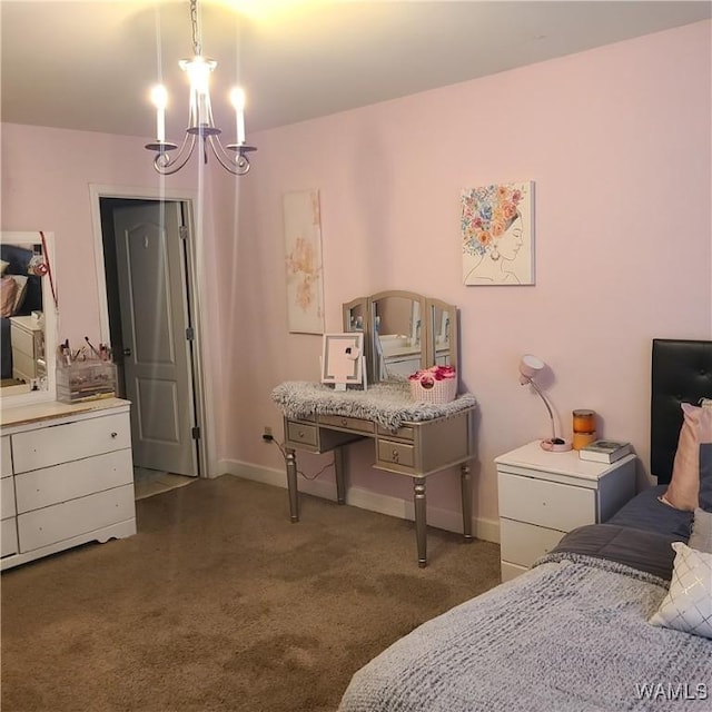 13712 Tab Dr, Northport, AL 35475 - carpeted bedroom featuring a chandelier and baseboards