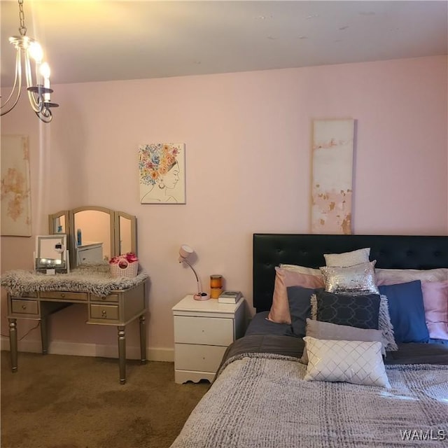 13712 Tab Dr, Northport, AL 35475 - carpeted bedroom with a chandelier and baseboards