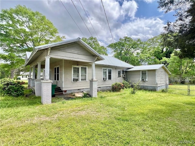 back of house with crawl space, a yard, metal roof, and fence