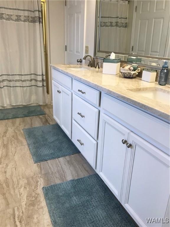 bathroom with double vanity, a sink, and a shower with shower curtain