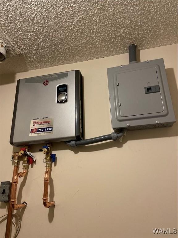 utilities with water heater and electric panel