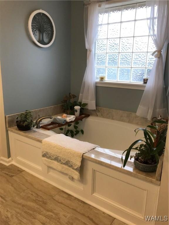 bathroom featuring a garden tub