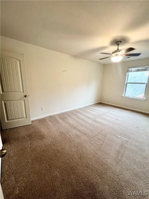11627 Andrew Way, Tuscaloosa, AL 35405 - carpeted spare room with baseboards and ceiling fan
