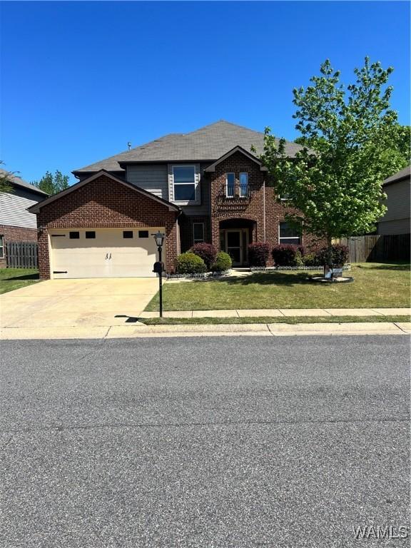 11627 Andrew Way, Tuscaloosa, AL 35405 - traditional-style home featuring fence, concrete driveway, an attached garage, brick siding, and a front yard
