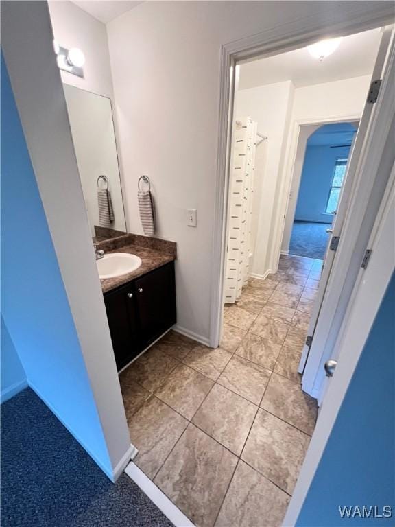 11627 Andrew Way, Tuscaloosa, AL 35405 - bathroom featuring tile patterned flooring, baseboards, and vanity