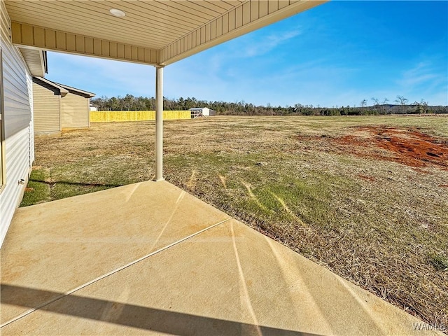 view of yard featuring a rural view and a patio area