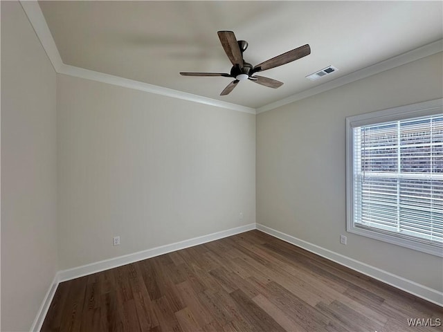 empty room with dark hardwood / wood-style flooring, ceiling fan, and ornamental molding