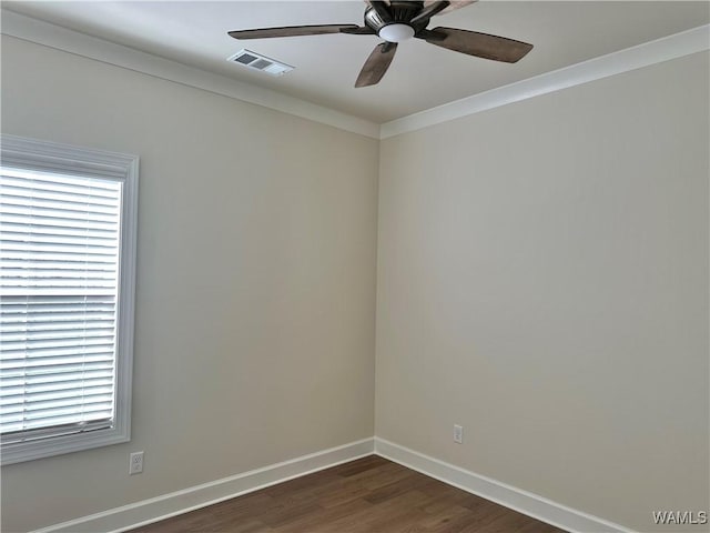 unfurnished room with ceiling fan, dark hardwood / wood-style flooring, and crown molding