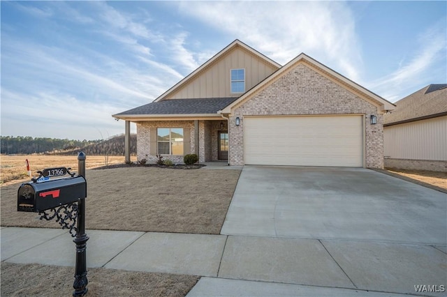 view of front of house featuring board and batten siding, concrete driveway, an attached garage, and brick siding