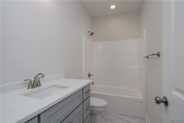 full bathroom featuring toilet, marble finish floor, shower / washtub combination, recessed lighting, and vanity