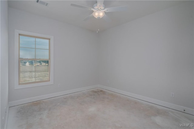 empty room featuring a ceiling fan, baseboards, visible vents, and concrete floors