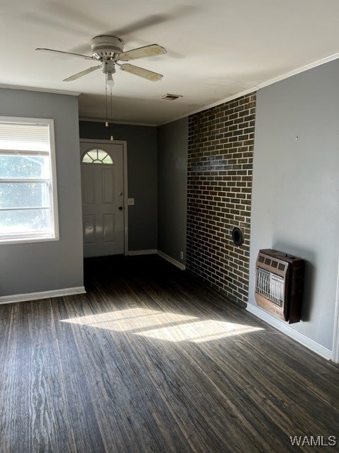 foyer with ceiling fan, ornamental molding, dark wood-type flooring, and heating unit