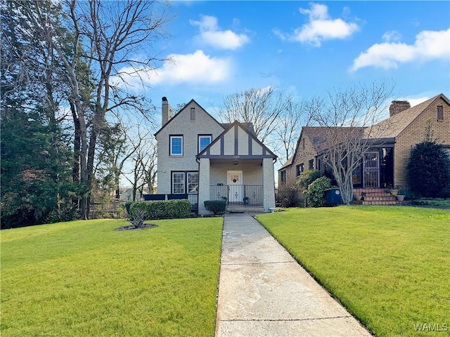 view of front of property with a front lawn and a porch