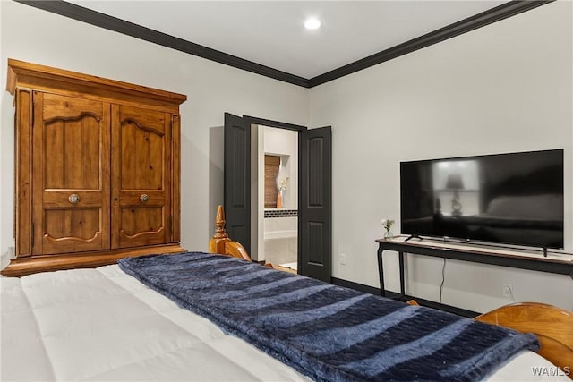 bedroom featuring ornamental molding, connected bathroom, and baseboards