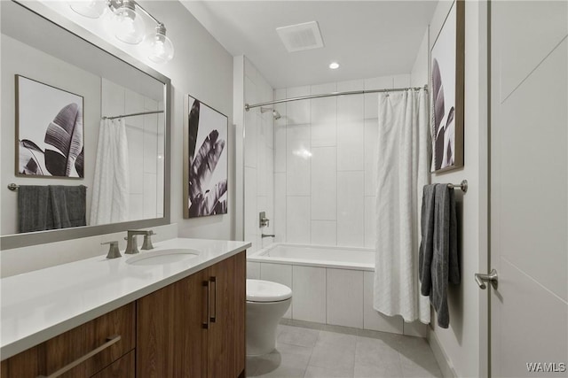 full bathroom with vanity, toilet, tile patterned flooring, and shower / tub combo