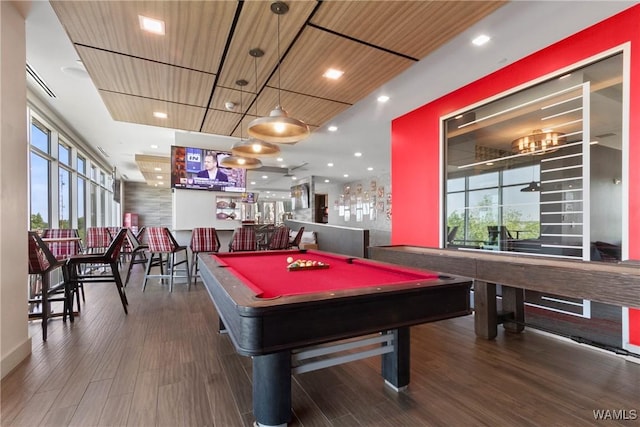 rec room with hardwood / wood-style flooring, pool table, bar area, and wooden ceiling