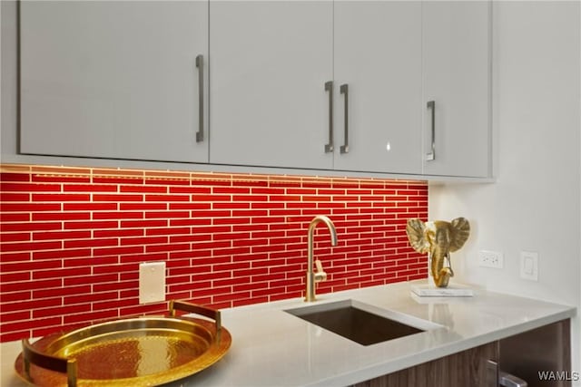 interior details with sink and backsplash