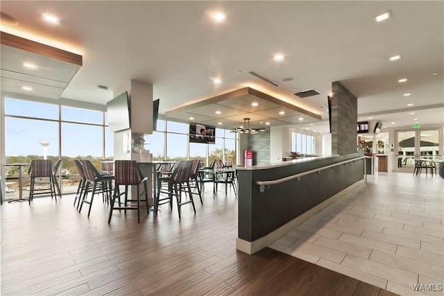 interior space with an inviting chandelier and floor to ceiling windows