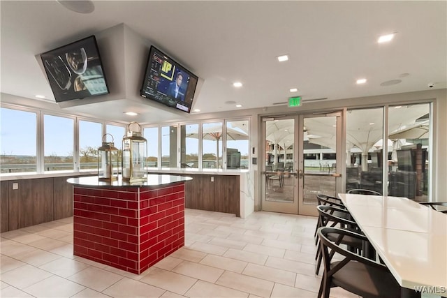 kitchen with a kitchen island and light tile patterned floors