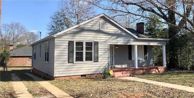 bungalow featuring a porch and a front yard