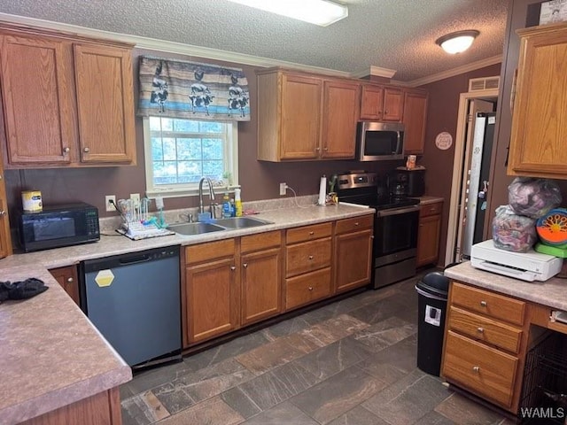 950 Pine Tree Rd, Centreville, AL 35042 - kitchen with stainless steel appliances, crown molding, light countertops, a textured ceiling, and brown cabinetry