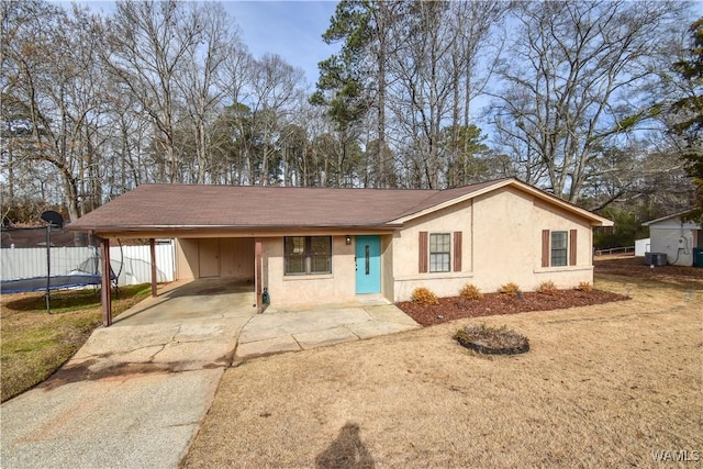 single story home with cooling unit and a carport