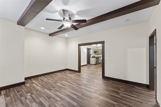 spare room with beamed ceiling, ceiling fan with notable chandelier, and dark wood-type flooring