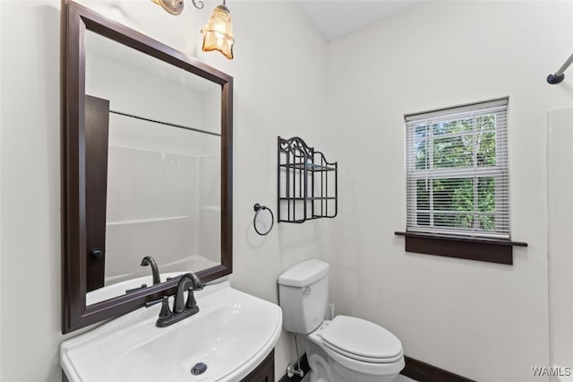 bathroom with toilet and sink