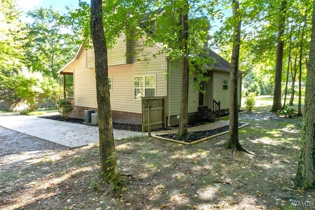 view of side of property with cooling unit