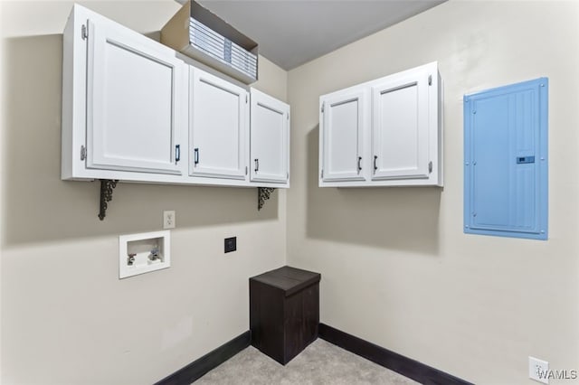 clothes washing area featuring cabinets, washer hookup, electric panel, and hookup for an electric dryer