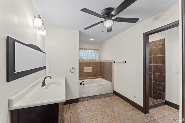 bathroom featuring plus walk in shower, vanity, tile patterned floors, and ceiling fan