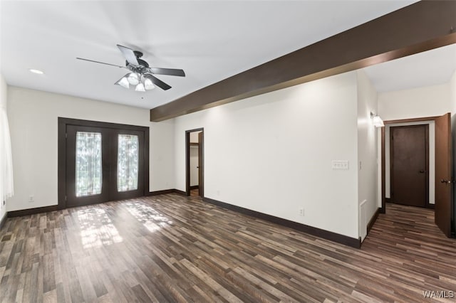 spare room with ceiling fan, dark wood-type flooring, and french doors