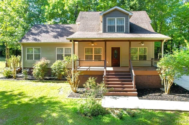 view of front of house featuring a porch, ceiling fan, and a front lawn