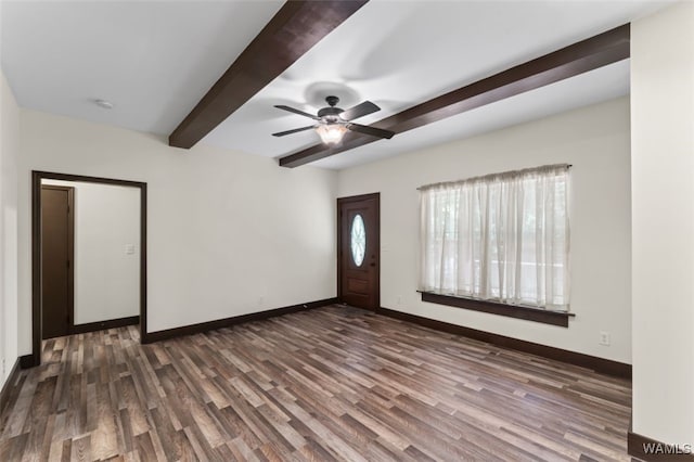 foyer featuring beamed ceiling, dark hardwood / wood-style flooring, and ceiling fan