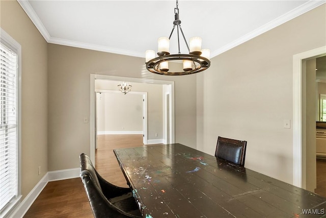 unfurnished dining area with a notable chandelier, baseboards, ornamental molding, and dark wood-style floors