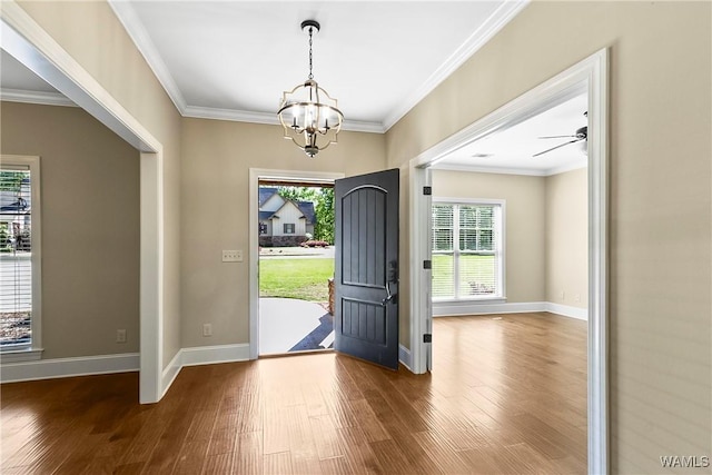 foyer featuring plenty of natural light, a chandelier, and wood finished floors