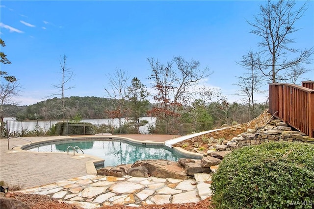 view of pool featuring a fenced backyard, a water slide, a fenced in pool, and a patio