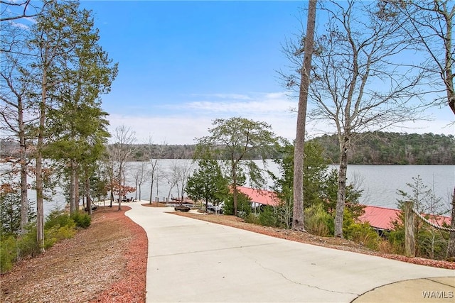 surrounding community with a water view