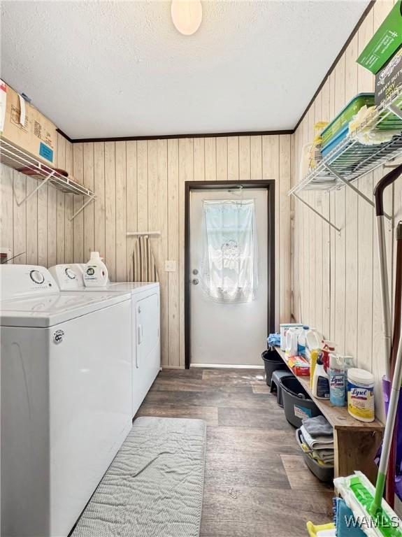 234 Broad Leaf Cir, Moundville, AL 35474 - laundry room with separate washer and dryer, wood walls, wood finished floors, and a textured ceiling