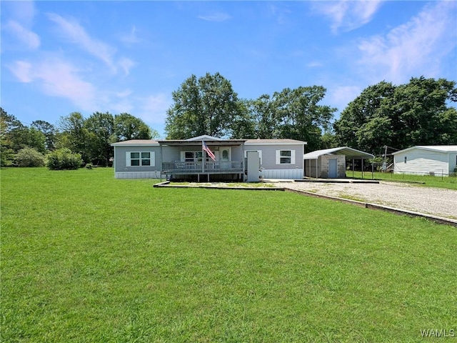 234 Broad Leaf Cir, Moundville, AL 35474 - manufactured / mobile home featuring driveway, a porch, a front yard, and a carport