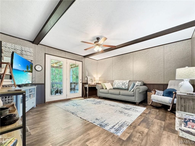234 Broad Leaf Cir, Moundville, AL 35474 - living room featuring a decorative wall, wood finished floors, ceiling fan, beamed ceiling, and a textured ceiling