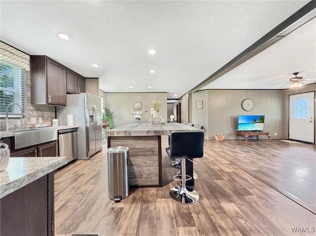 234 Broad Leaf Cir, Moundville, AL 35474 - kitchen featuring stainless steel appliances, dark brown cabinetry, light wood-style floors, light countertops, and recessed lighting