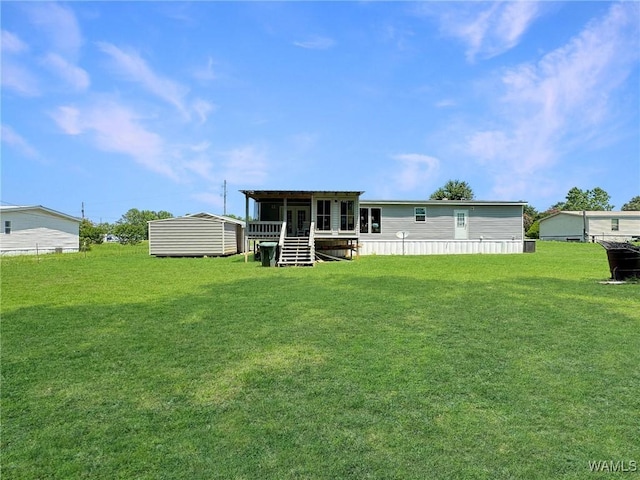 234 Broad Leaf Cir, Moundville, AL 35474 - back of property with a storage shed, an outdoor structure, and a yard