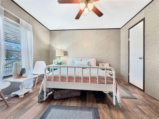 234 Broad Leaf Cir, Moundville, AL 35474 - bedroom with wood finished floors, ornamental molding, and ceiling fan